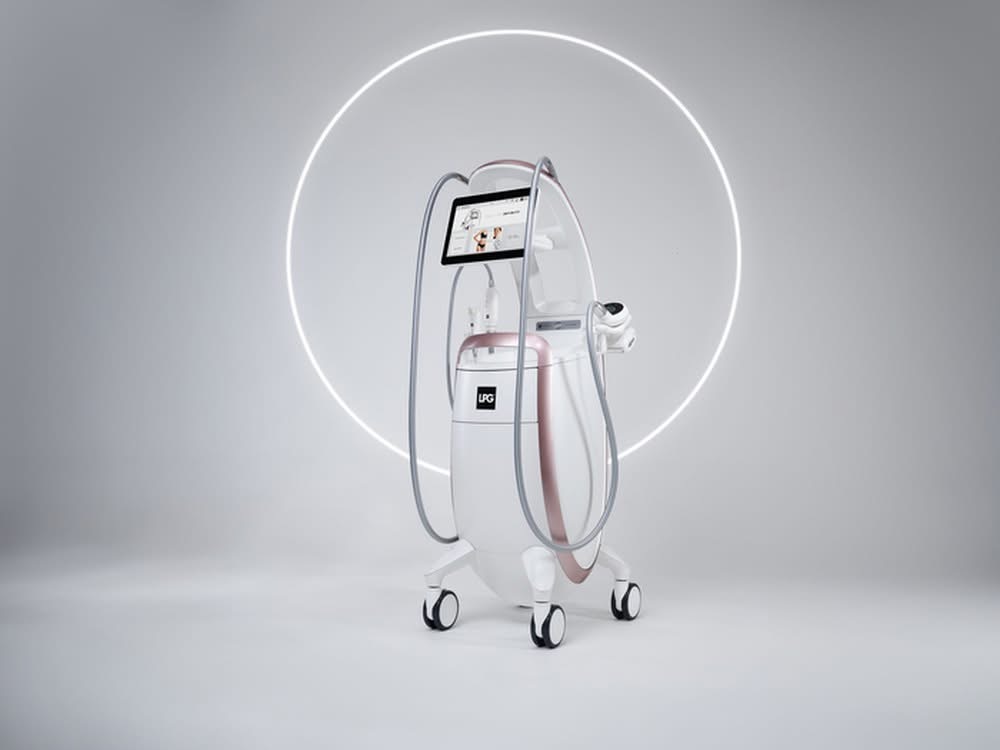 The LPG Endermologie machine at Anastasia's Crown, lit softly in the private Shadyside treatment room.